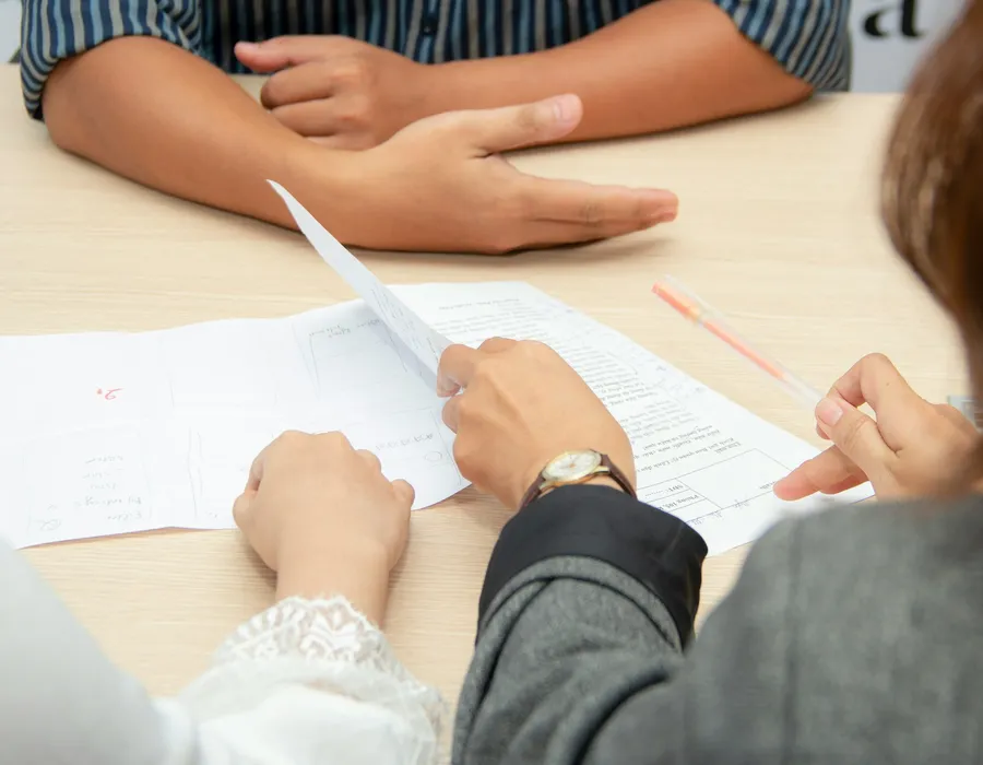 Business professionals reviewing documents during a consultation